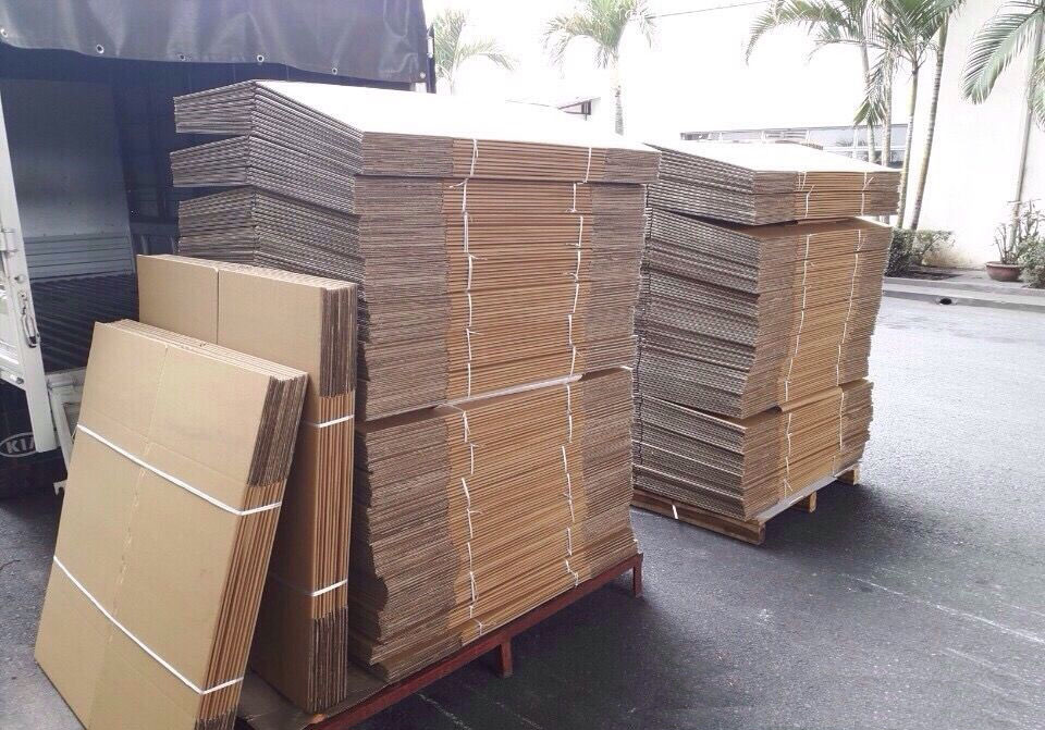 A large quantity of carton boxes stacked